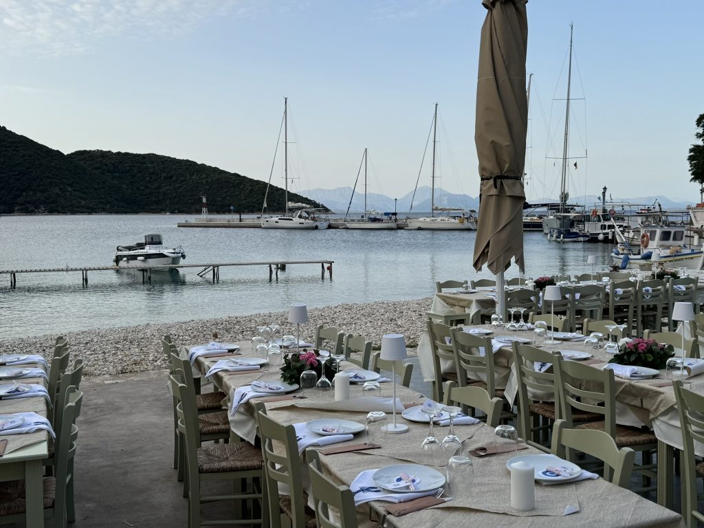 Wedding reception tables at beach restaurant in Ithaca Greece, Frikes