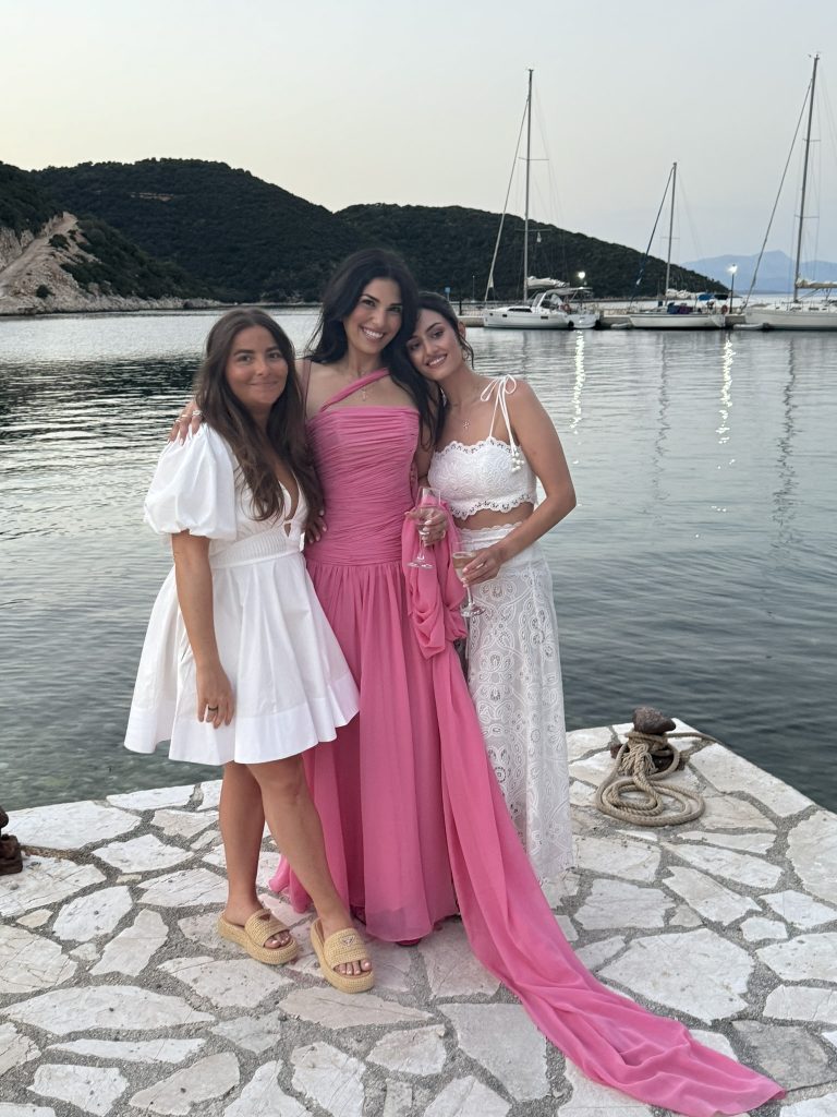 Bride with friends at beach wedding reception in Ithaca Greece, Frikes