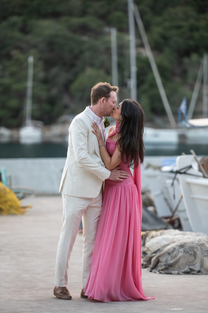 Newlywed couple at waterfront wedding reception in Ithaca Greece, Frikes