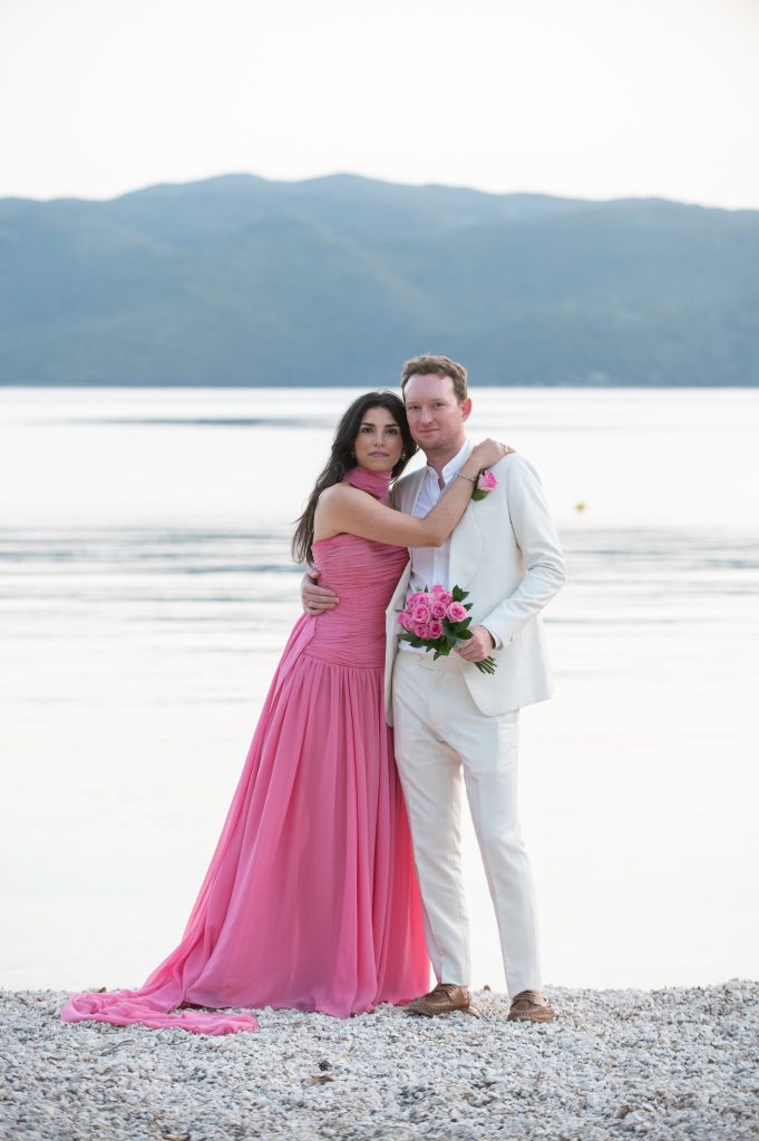 Newlywed couple at waterfront wedding reception in Ithaca Greece, Frikes
