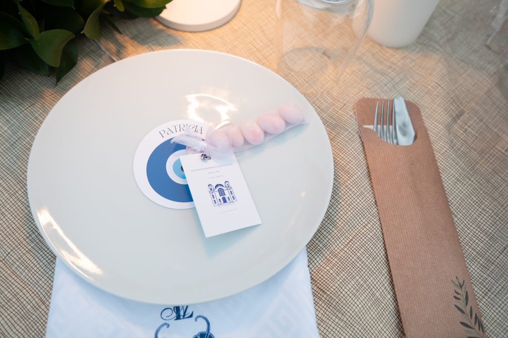 Wedding favors on plates at wedding reception in Ithaca Greece, Frikes