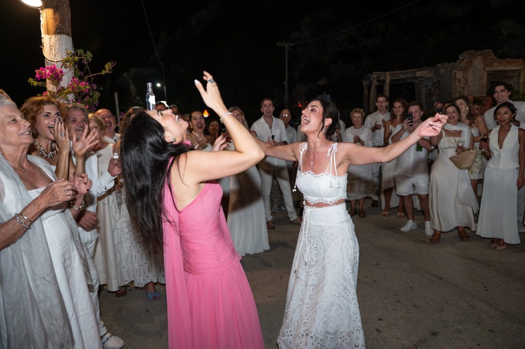 Traditional Greek dance zeimbekiko at Greek wedding in Ithaca Greece, Frikes