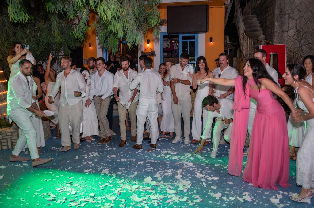 Smashing the plates at Greek wedding reception in Ithaca Greece, Frikes