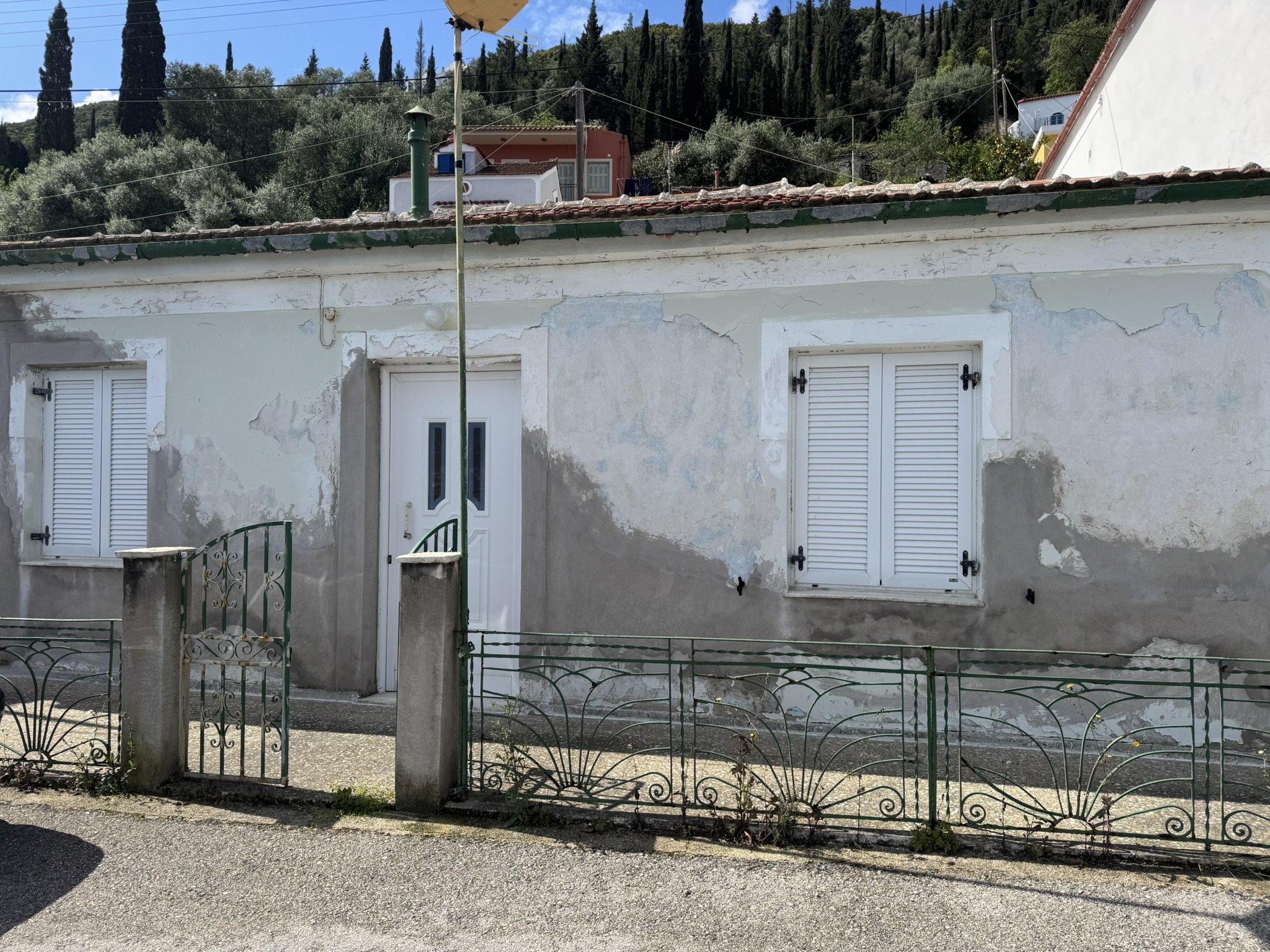 Road view of house for sale in Ithaca Greece, Vathi