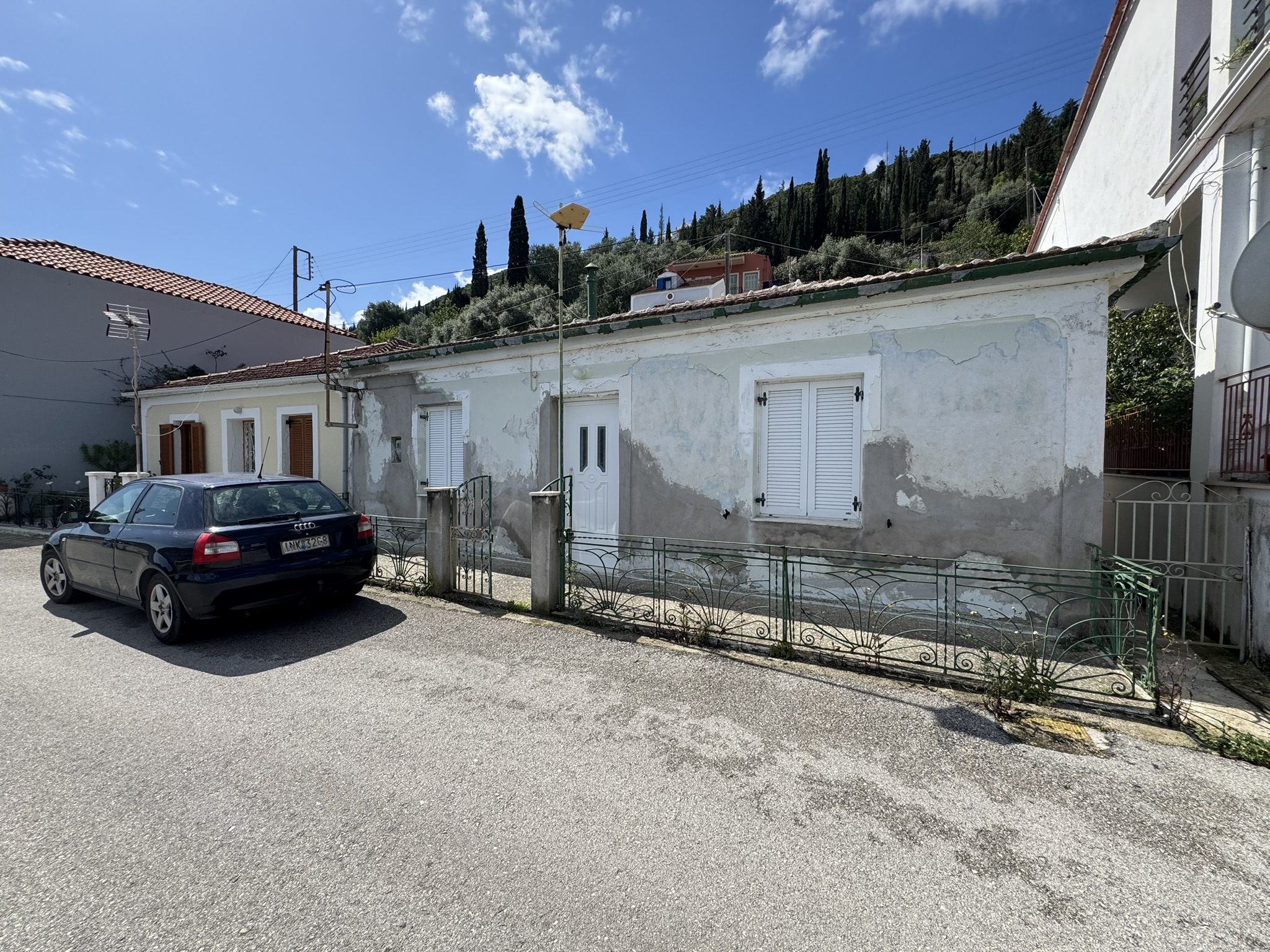 Road view of house for sale in Ithaca Greece, Vathi