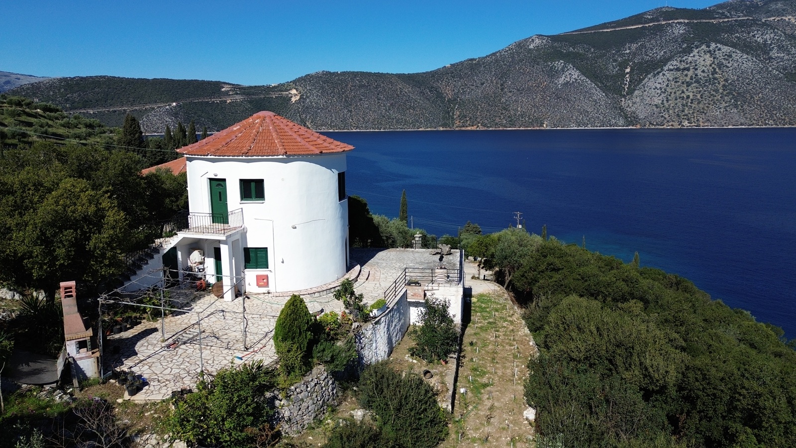 Aerial view of windmill house for sale in Ithaca Greece, Vathi
