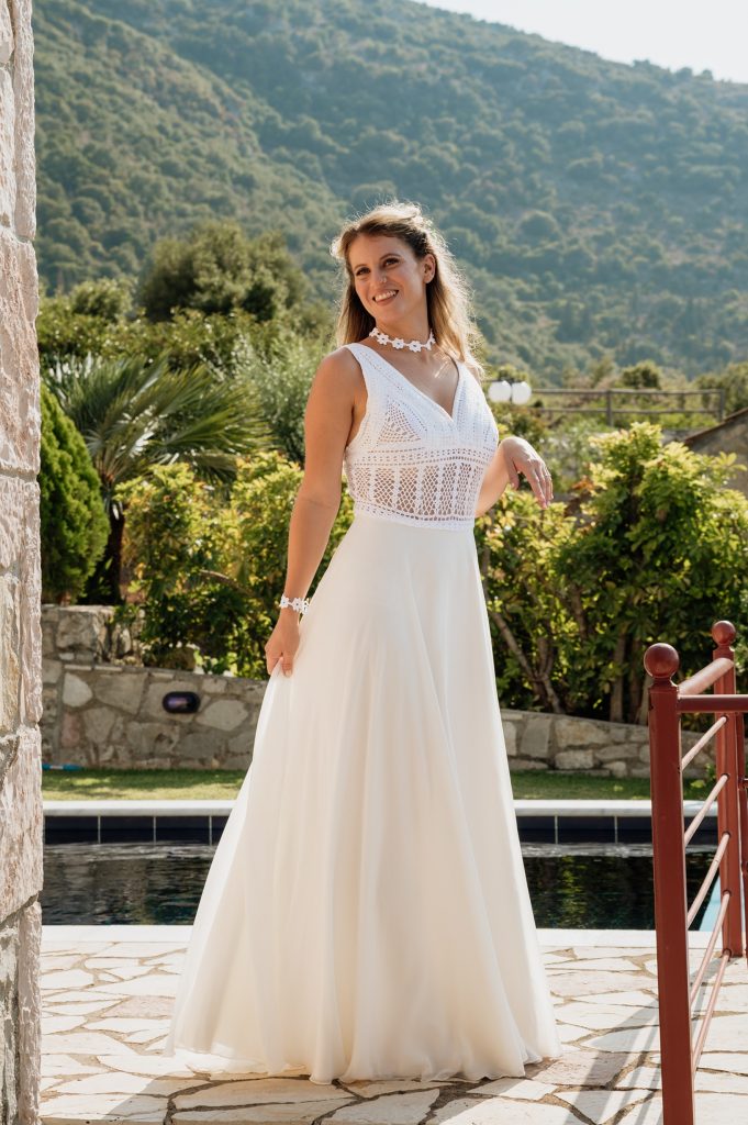 Bride getting dressed for wedding in Ithaca Greece, Vathi