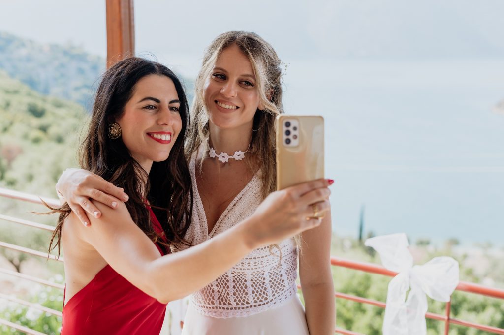 Bride getting dressed for wedding in Ithaca Greece, Vathi