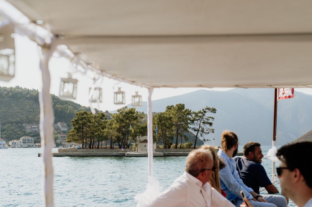 Boat shuttle transporting wedding guests at Lazareto chapel in Ithaca Greece, Vathi