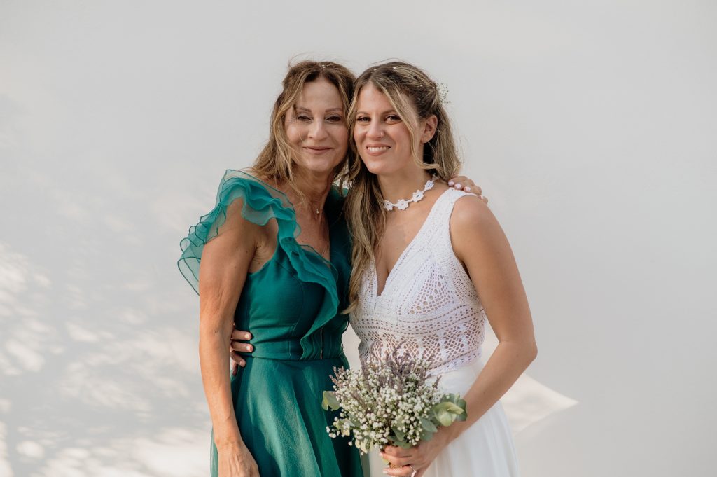Bride getting dressed for wedding in Ithaca Greece, Vathi