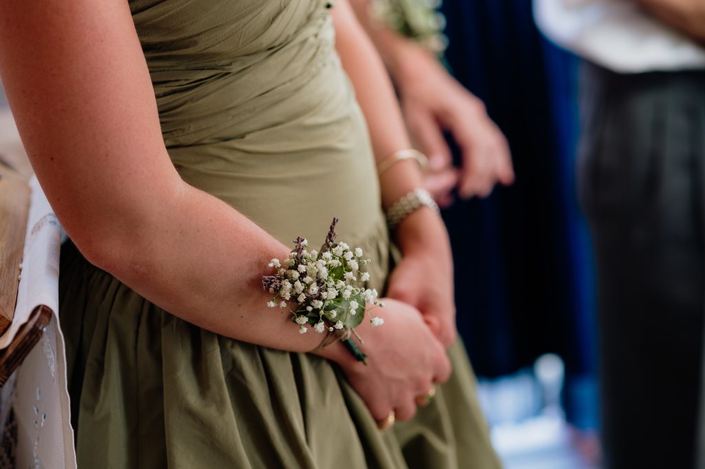 Bridesmaid wrist flowers at wedding ceremony in Ithaca Greece, Vathi