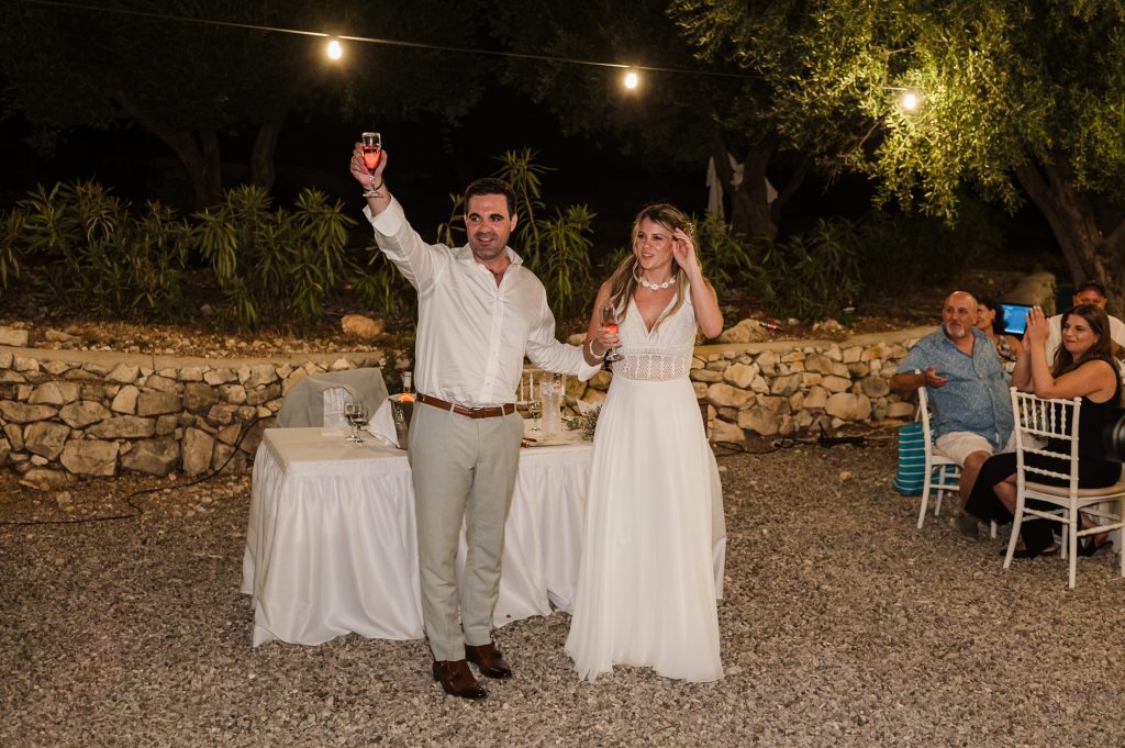 Newlywed couple at beach wedding party in Ithaca Greece, Vathi