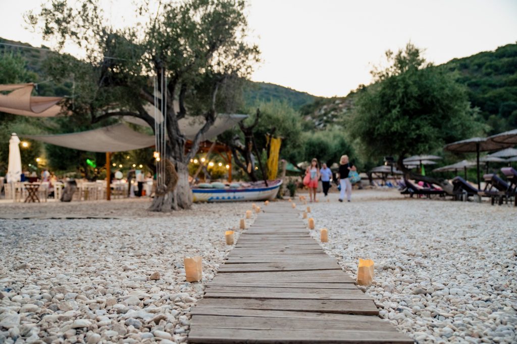Candle lights arrangement at beach wedding party in Ithaca Greece, Vathi