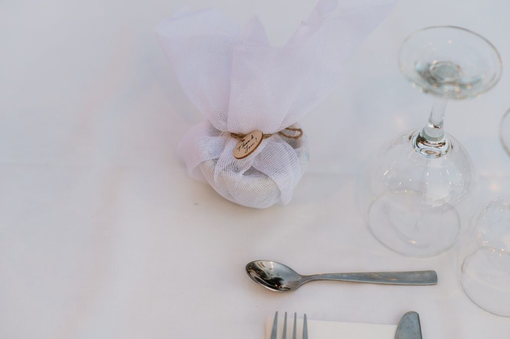 Party favors on table at beach wedding reception in Ithaca Greece, Vathi