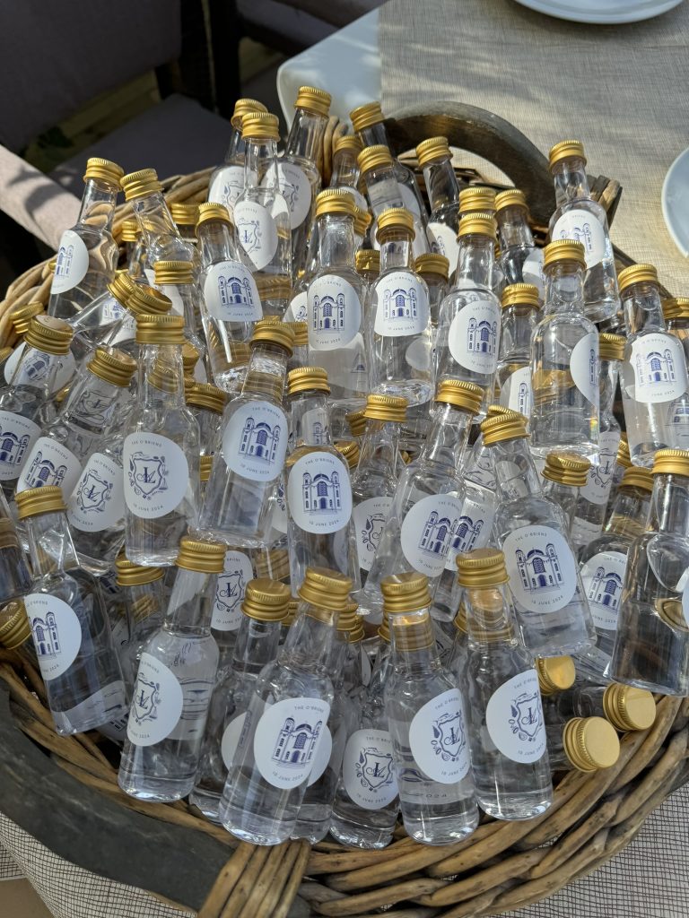 Small ouzo bottles offered in gift for guests at wedding reception for guests at wedding reception in Ithaca Greece, Frikes